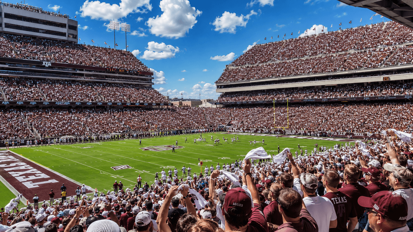 Inside Kyle Field on game day — Aggie fans cheering with towels waving